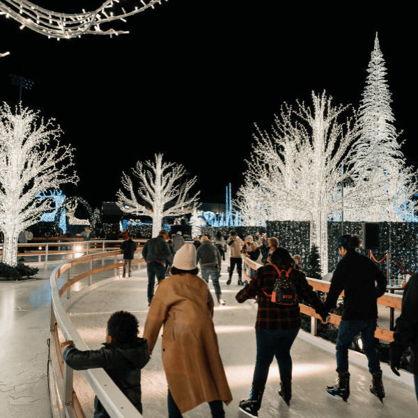Guests ice skating through a winter wonderland at Enchant.