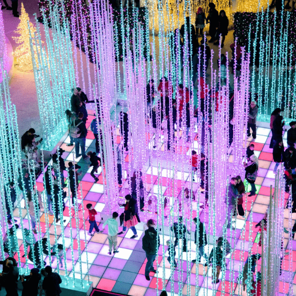 Cheerful atmosphere with holiday beats and dancing under the lights.